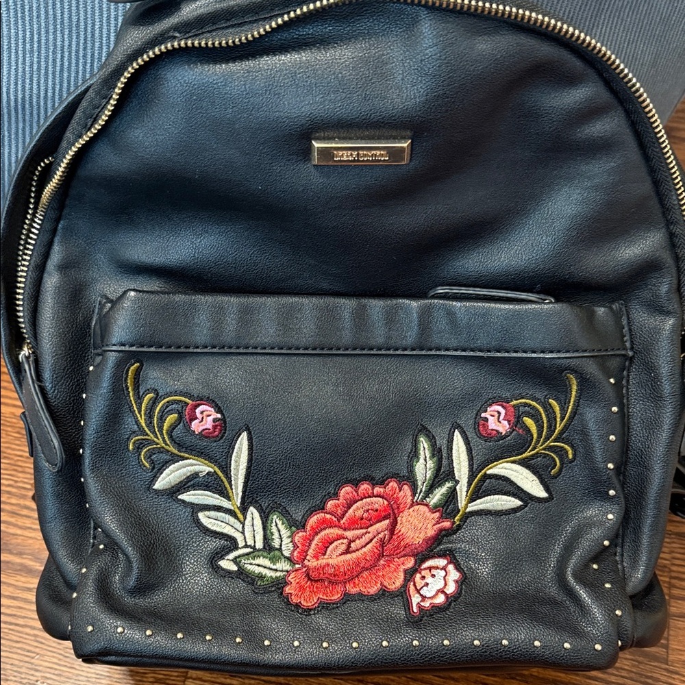 Elegant Black Backpack with Red Floral Design